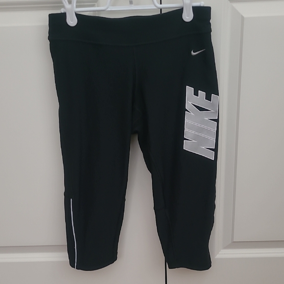 Nike Pants - Nike Black Leggings With Silver NIKE LOGO